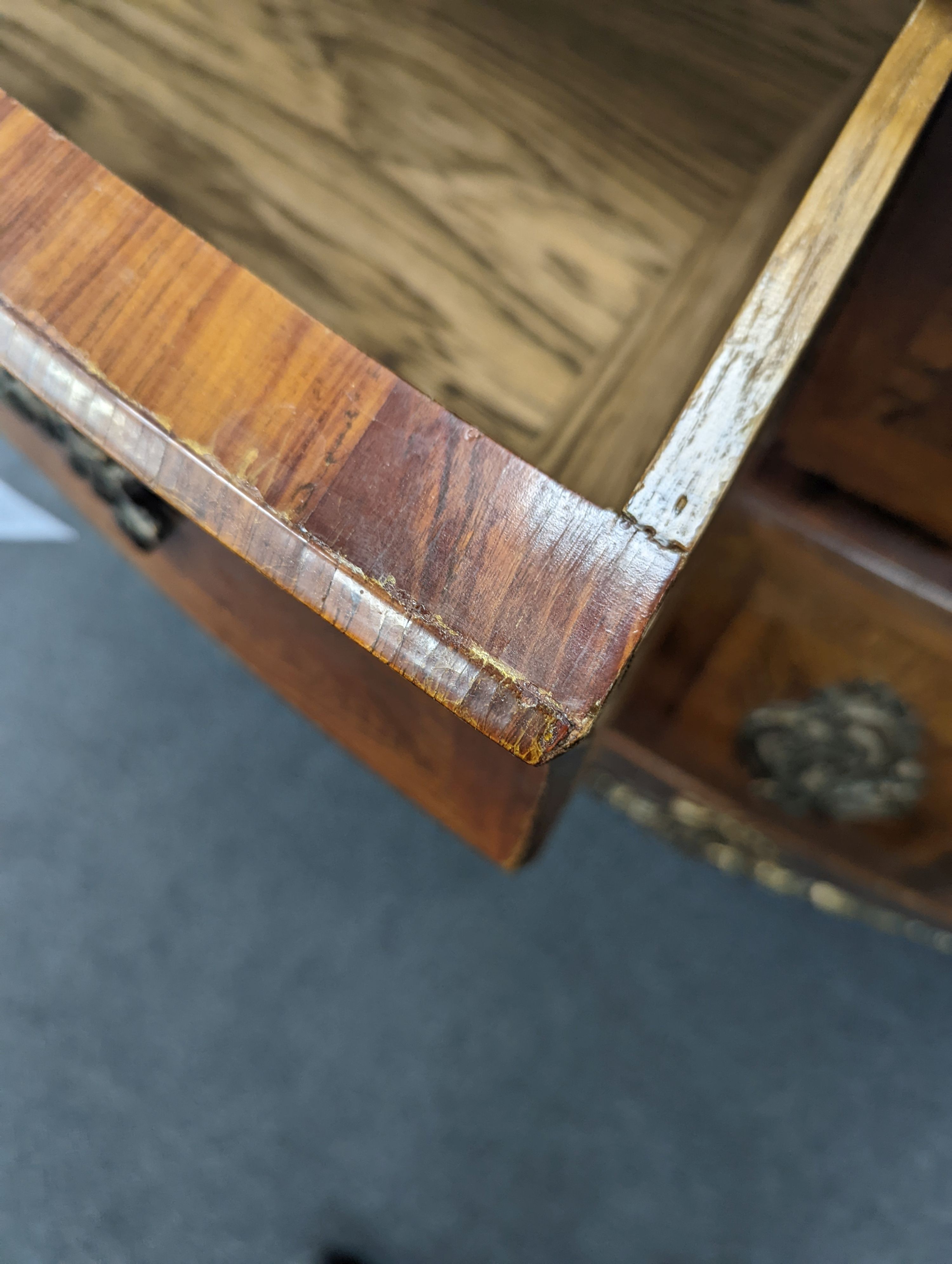 A Louis XV style marble topped serpentine bombe commode - impressed maker's stamp, M.P., width 140cm, depth 59cm, height 90cm